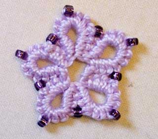 Beaded crotat flower.